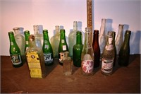 18 early bottles: soda, whisky, vanilla, etc., tal