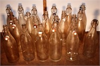 21 early clear glass ceramic cap and bale bottles,