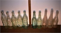 10 early glass bottles; as is
