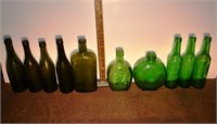 10 early green glass bottles; as is