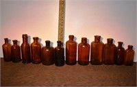 12 early brown glass bottles, tallest 6"h; as is