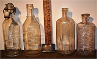4 early clear glass bottles, tallest 7.5"h; as is