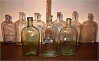 9 early glass pint whiskey bottles; as is