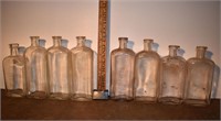 8 early clear glass bottles: Henry K. Wampole, etc