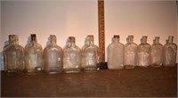 15 early clear glass 1/2 pint bottles: