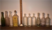 10 early glass bottles including Watkins w/label,