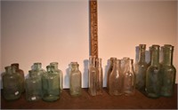 21 early glass bottles: Davis, Mumford, Hires, Wel