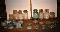 8 early canning jars and a group of metal and glas