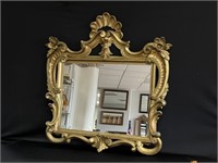 Decorative gold tone mirror