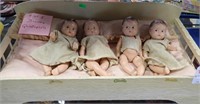 4 OF 5 DIONNE QUINTUPLETS DOLLS W/ BED