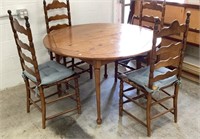 48" Diameter wooden table/ four ladderback chairs