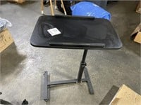 Adjustable bed side table