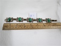 7.5 In bracelet set with green faux stones and