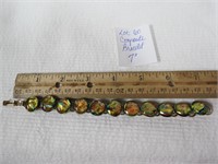 7 inch Bracelet with yellow/green hues in settings