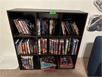 BOOKCASE W VHS TAPES / DVD'S DISNEY MORE