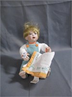 porclien doll with blanket