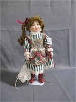 porclien doll with stand