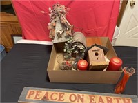 Decorative bird houses in peace on Earth sign