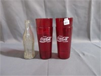 coca cola cups and bottle .