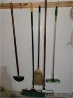 Yard tools and brooms (garage)