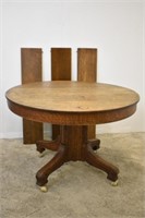 ROUND SOLID OAK DINING TABLE WITH 3 LVS