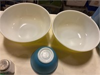 Two large Pyrex bowls, one small