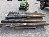 (12) wooden fence posts