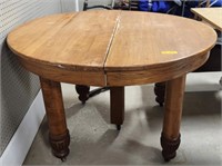 Round wooden table, measures 48 in across, does
