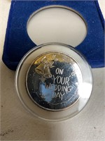 One troy ounce 999 silver (on your wedding day.)