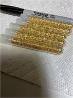 5 tubes of gold flakes