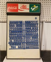 Coca-Cola/sprite sign with letters