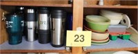 Contents of shelf: many travel cups - plastic