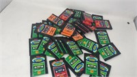 multiple packs of sealed 1990s sports cards
