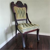 Antique Tufted Chair on Wooden Casters