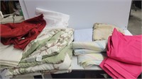 Large lot of bed sheets and comforters