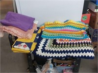 2 crocheted blankets a quilt and a wool blanket