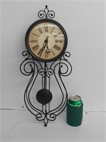 Battery operated clock with working pendulum