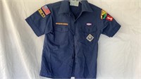F7)  Cub Scout shirt with patches