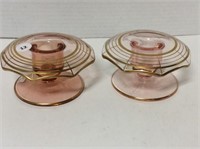Pair of pink glass candleholders with gold toned
