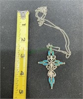 Cross pendant on silver tone chain with turquoise-