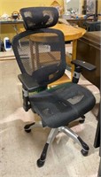 Nice mesh and metal five legged office chair on