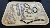 Tray lot of costume jewelry includes bracelets,