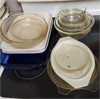 GLASS BAKEWARE & LIDS ON STOVE