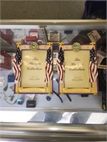 2 picture frames with 2 flags each side and middle