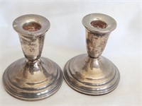 Pair sterling silver candlesticks.   Weighted.