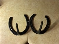 Horseshoe coat hangers