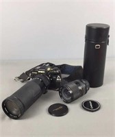 Minolta X 700 Slr Camera And Two Zoom Lenses