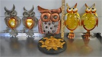 Metal owls, pottery sun outdoors decor