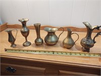 Six piece collection of brass pitchers and