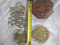 Collection of brass and wood trivets